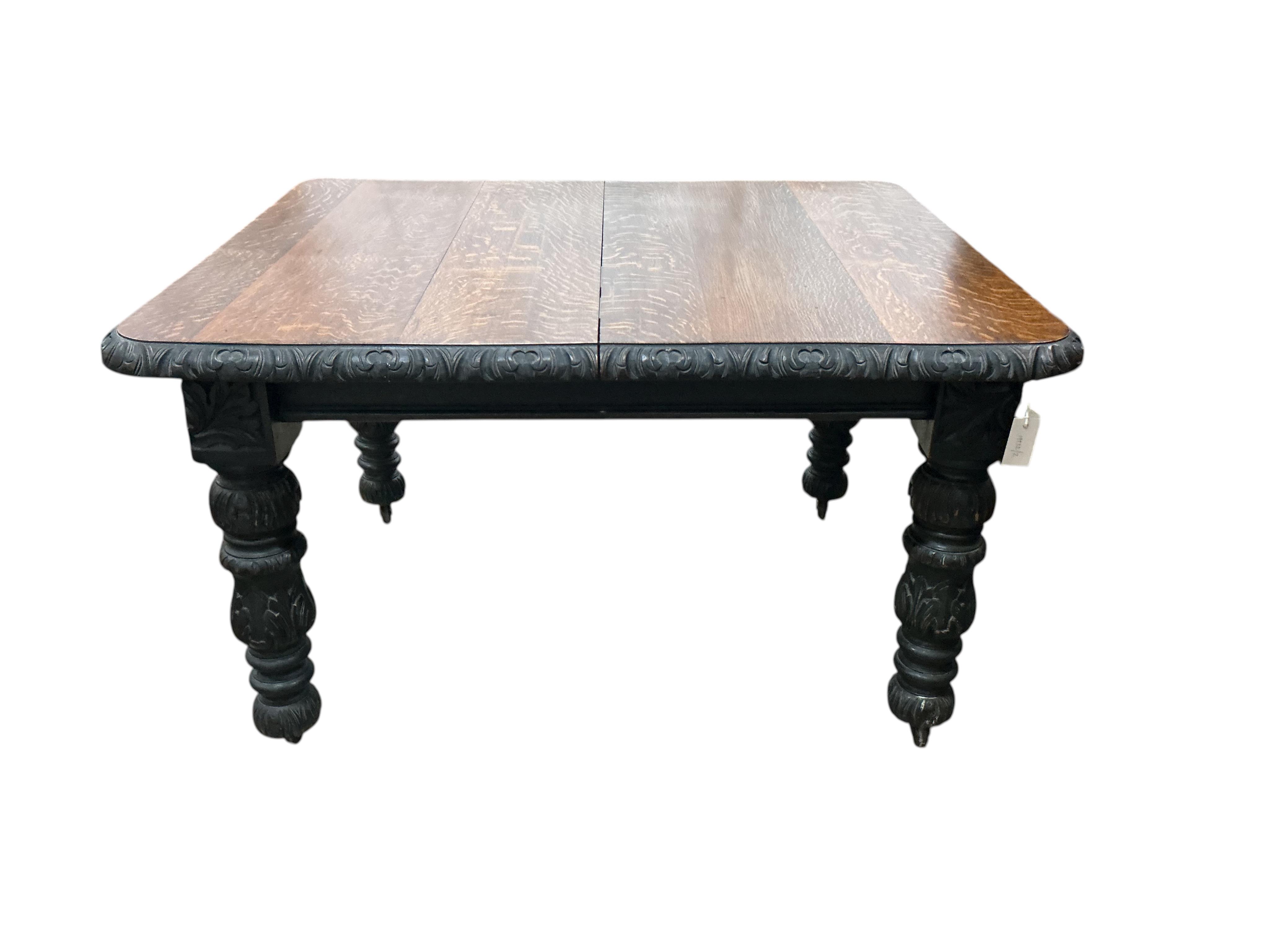 A late Victorian carved oak extending dining table, width 176cm extended, one spare leaf, depth 104cm, height 73cm